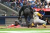 Blue Jays infielder Ernie Clement (22) slides safely into home ahead of a tag by Athletics catcher Shea Langeliers (23) in the second inning of a Major League Baseball game in Toronto on Friday, May 30, 2025. THE CANADIAN PRESS/Jon Blacker