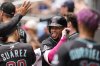 Arizona Diamondbacks second baseman Ketel Marte (4) celebrates his solo homer against the Atlanta Braves in the eighth inning of a baseball game, Thursday, June 5, 2025, in Atlanta. (AP Photo/Mike Stewart)