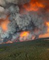 Flame and smoke fill the sky above a large wildfire burning in the La Ronge, Sask., area in an undated handout photo. THE CANADIAN PRESS/HO-Saskatchewan Public Safety Agency, *MANDATORY CREDIT*