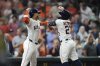 Houston Astros' Jose Altuve (27) celebrates his two-run home run with Jeremy Peña, left, against the Athletics during the fourth inning of a baseball game, Tuesday, May 27, 2025, in Houston. (AP Photo/Karen Warren)