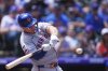New York Mets' Pete Alonso swings at a pitch form Colorado Rockies starting pitcher Chase Dollander in the first inning of a baseball game, Sunday, June 8, 2025, in Denver. (AP Photo/David Zalubowski)