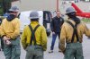 Manitoba Premier Wab Kinew greets and chats with the Logan Hotshots from the U.S. Forest Service as they get ready to drop into a hot zone for the day during a tour of wildfires in the surrounding area of Flin Flon, Man., on Thursday, June 12, 2025. THE CANADIAN PRESS/Mike Deal-Pool