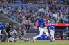 Toronto Blue Jays' Vladimir Guerrero Jr. (27) hits a two-run single against the New York Yankees during sixth inning MLB baseball action, in Toronto on Monday, June 30, 2025. THE CANADIAN PRESS/Thomas Skrlj