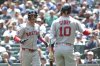 Boston Red Sox Marcelo Mayer, left, celebrates with Trevor Story (10) after hitting a solo home run off Seattle Mariners starting pitcher Luis Castillo during the second inning of a baseball game, Wednesday, June 18, 2025, in Seattle. (AP Photo/Jason Redmond)
