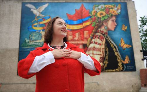 Ruth Bonneville / Free Press
                                LOCAL - Pray for Ukraine mural Photo of Ukrainian activist Liudmyla Shykota, who spearheaded the vision and funding for a new striking mural at 492 Main called - Pray for Ukraine, at the unveiling Monday. Shykota worked with local artist, Jennifer Mosienko, who has been painted over forty murals in the city. The vision Shykota shared with the artist was to connect the spirit of Ukraine with Winnipeg Canada bringing hope and prosperity to both nations. See story June 9th, 2025