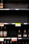 MIKAELA MACKENZIE / FREE PRESs fileS
                                Shelves emptied of American alcohol at a Liquor Mart.