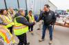 MIKE DEAL / FREE PRESS
                                Premier Wab Kinew meets with staff from the MMF outside the evacuation centre at the Thompson Regional Community Centre in Thompson. Premier Wab Kinew toured areas hit by wildfires in northern Manitoba, making stops in Flin Flon and Thompson. His response to the wildfire may be part of the reason for the NDP&rsquo;s increased popularity, says an expert.