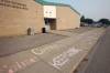 (Tim Smith/The Brandon Sun)
                                Messages of affirmation and support written in chalk cover the sidewalks outside École Secondaire Neelin High School in Brandon after a fifteen-year-old student was attacked by a fellow student with a sword and seriously injured last week.