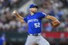 Kansas City Royals pitcher Michael Wacha pitches in the first inning of a baseball game against the Texas Rangers, Thursday, June 19, 2025, Arlington, Texas. (AP Photo/Albert Pena)