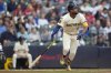 Milwaukee Brewers' Jackson Chourio watches after hitting a two-run home run during the third inning of a baseball game against the Atlanta Braves, Tuesday, June 10, 2025, in Milwaukee. (AP Photo/Aaron Gash)