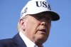 U.S. President Donald Trump speaks with reporters before boarding Air Force One at Morristown Municipal Airport in Morristown, N.J., Sunday, July 6, 2025, en route to Washington. (AP Photo/Jacquelyn Martin)