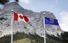 A Canada flag, left, and an Alberta flag flap in the breeze with Mt. Kidd in the background at the site of the G7 Leaders meeting in Kananaskis, Alta., Monday, June 2, 2025. THE CANADIAN PRESS/Jeff McIntosh