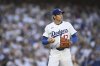 Los Angeles Dodgers starting pitcher Shohei Ohtani prepares to pitch during the first inning of a baseball game against the San Diego Padres, Monday, June 16, 2025, in Los Angeles. (AP Photo/Kyusung Gong)