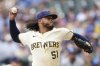 Milwaukee Brewers' Freddy Peralta pitches during the first inning of a baseball game against the Los Angeles Dodgers, Monday, July 7, 2025, in Milwaukee. (AP Photo/Aaron Gash)