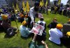 Posters are handed out as people participate in a protest organized by Sikh groups against the visit of Indian Prime Minister Narendra Modi to Canada for the G7 Summit, on Parliament Hill in Ottawa, on Saturday, June 14, 2025. THE CANADIAN PRESS/Justin Tang