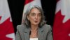 Julie Dabrusin, Minister of Environment and Climate Change, speaks in the National Press Theatre in Ottawa on Thursday, June 12, 2025. THE CANADIAN PRESS/Sean Kilpatrick