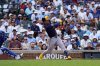 Milwaukee Brewers' Isaac Collins hits a three-run home run against the Chicago Cubs during the fifth inning of a baseball game Thursday, June 19, 2025, in Chicago. (AP Photo/David Banks)