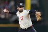 Texas Rangers starting pitcher Nathan Eovaldi throws to the Atlanta Braves in the second inning of a baseball game Friday, July 25, 2025, in Arlington, Texas. (AP Photo/Tony Gutierrez)