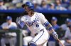 Kansas City Royals' Jonathan India watches his three-run home run to win the game during the 10th inning in the first baseball game of a doubleheader against the Cleveland Guardians, Saturday, July 26, 2025, in Kansas City, Mo. (AP Photo/Charlie Riedel)