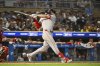 Boston Red Sox's Roman Anthony hits an RBI single to center field against Minnesota Twins pitcher Jhoan Duran during the ninth inning of a baseball game, Monday, July 28, 2025, in Minneapolis. David Hamilton scored. (AP Photo/Craig Lassig)