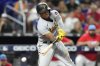 FILE - Pittsburgh Pirates' Ke'Bryan Hayes, recently traded to the Cincinnati Reds, strikes out swinging during the fourth inning of a baseball game against the Miami Marlins, June 24, 2023, in Miami. (AP Photo/Lynne Sladky, File)