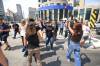 Ruth Bonneville / Free Press
                                Pedestrians and event-goers high-five each other while crossing Portage and Main over the lunch hour on Tuesday.