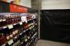 Canadian whisky is advertised at a Liquor Mart in March while black plastic covers the U.S. whiskey section. The Manitoba government ordered American products removed from Liquor Marts in response to tariffs imposed by U.S. President Donald Trump. (Tim Smith / The Brandon Sun files)