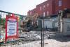 The rubble from buildings in the 800 block of Main Street that burned down in February are finally being cleaned up, following battles between the city, the province, and the building owners over asbestos testing. The city hopes to have them down by the end of the long weekend. (Mike Thiessen / Free Press files)