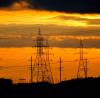 BORIS MINKEVICH / FREE PRESS FILES
                                A morning sunrise paints the sky behind hydro towers, power lines, and flying families in south east Winnipeg this morning.