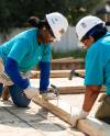 SUPPLIED 
                                Holly Jefferson (left) and members of the Bombers Women&rsquo;s Club work on a Habitat for Humanity house in Transcona last week.
