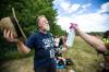 MIKAELA MACKENZIE / FREE PRESS
                                 Longtime folk fest attendee Greg Docker enjoys a spritz of water at the site last week.