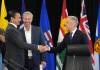 Nathan Denette / THE CANADIAN PRESS
                                Canadian Prime Minister Mark Carney, right, greets Manitoba Premier Wab Kinew, left, as Nova Scotia Premier Tim Houston looks on, during the 2025 summer meetings of Canada&rsquo;s Premiers at Deerhurst Resort in Huntsville, Ont., on Tuesday.
