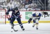 Winnipeg Jets' Dylan Samberg (54) breaks away from St. Louis Blues' Mathieu Joseph (71) during second-period NHL playoff action in Winnipeg on Saturday, April 19, 2025. THE CANADIAN PRESS/John Woods