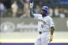 Milwaukee Brewers' Jackson Chourio gestures to the dugout after hitting an RBI double during the third inning of a baseball game against the Miami Marlins, Sunday, July 27, 2025, in Milwaukee. (AP Photo/Aaron Gash)