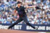 Toronto Blue Jays pitcher Chris Bassitt (40) works against the San Francisco Giants during first inning MLB baseball action in Toronto on Friday, July 18, 2025.  THE CANADIAN PRESS/Nathan Denette
