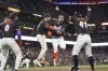 San Francisco Giants' Patrick Bailey, middle right, celebrates with teammates after hitting a three-run inside the park home run during the ninth inning of a baseball game to defeat the Philadelphia Phillies in San Francisco, Tuesday, July 8, 2025. (AP Photo/Jeff Chiu)