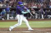 Arizona Diamondbacks' Randal Grichuk connects for an inside-the-park home run against the Kansas City Royals during the eighth inning of a baseball game Saturday, July 5, 2025, in Phoenix. (AP Photo/Ross D. Franklin)