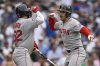 Boston Red Sox's Alex Bregman, right, celebrates with teammate Wilyer Abreu, left, after hitting a three-run home run during the eighth inning of a baseball game against the Chicago Cubs, Sunday, July 20, 2025, in Chicago. (AP Photo/Paul Beaty)