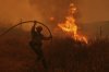 A firefighter battles the Canyon Fire on Thursday, Aug. 7, 2025, in Halsey Canyon, Calif. (AP Photo/Marcio Jose Sanchez)