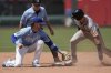 Atlanta Braves' Luke Williams, right, beats the tag by Kansas City Royals shortstop Bobby Witt Jr. to steal second during the eighth inning of a baseball game Wednesday, July 30, 2025, in Kansas City, Mo. (AP Photo/Charlie Riedel)