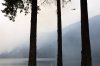 A helicopter refills a bucket of water near Cameron Lake off Highway 4, where the Wesley Ridge wildfire continues to burn near Coombs, B.C., on Sunday, Aug. 3, 2025. THE CANADIAN PRESS/Chad Hipolito