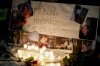 A memorial with photos of Morgan Harris attached is shown as family and friends gather at a vigil in Winnipeg, Thursday, Dec. 1, 2022.  THE CANADIAN PRESS/John Woods