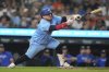 Toronto Blue Jays' Alejandro Kirk swings for a strike during the ninth inning of a baseball game against the Detroit Tigers, Friday, July 25, 2025, in Detroit. (AP Photo/Ryan Sun)