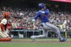 New York Mets' Juan Soto, right, hits a home run in front of San Francisco Giants catcher Patrick Bailey, left, during the seventh inning of a baseball game in San Francisco, Sunday, July 27, 2025. (AP Photo/Jed Jacobsohn)