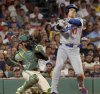 Los Angeles Dodgers designated hitter Shohei Ohtani (17) strikes out during the seventh inning of a baseball game against the Boston Red Sox, Friday, July 25, 2025, in Boston. (AP Photo/Mark Stockwell)
