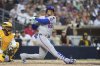 New York Mets' Juan Soto reacts after fouling a ball off his leg while batting during the fourth inning of a baseball game against the San Diego Padres Tuesday, July 29, 2025, in San Diego. (AP Photo/Gregory Bull)