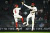 Los Angeles Angels' Jo Adell, right, and Zach Neto celebrate after winning a baseball game against the Texas Rangers Monday, July 28, 2025, in Anaheim, Calif. (AP Photo/William Liang)