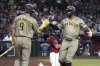 San Diego Padres' Xander Bogaerts celebrates with Jake Cronenworth (9) after hitting a solo home run against the Arizona Diamondbacks in the seventh inning during a baseball game, Wednesday, Aug 6, 2025, in Phoenix. (AP Photo/Rick Scuteri)