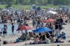 Beaches in Toronto are packed as people find ways to embrace temperatures up to 36 degrees Celsius on Monday June 23, 2025. THE CANADIAN PRESS/Frank Gunn
