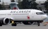 An Air Canada jet is manoeuvred on the tarmac at the airport, Wednesday, Nov.15, 2023 in Vancouver.  THE CANADIAN PRESS/Adrian Wyld
